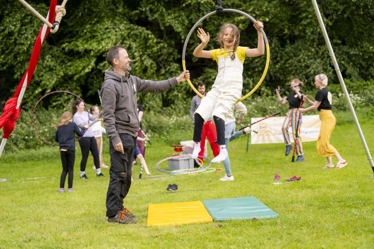 Moray Flying Circus - Ruaraidh spotting Agatha on aerial hoop (photo Mark Richards)