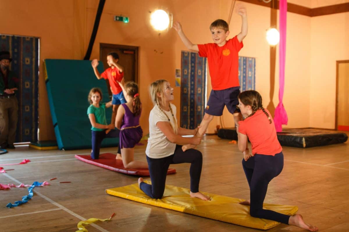 Kids doing acrobatics at a showcase event